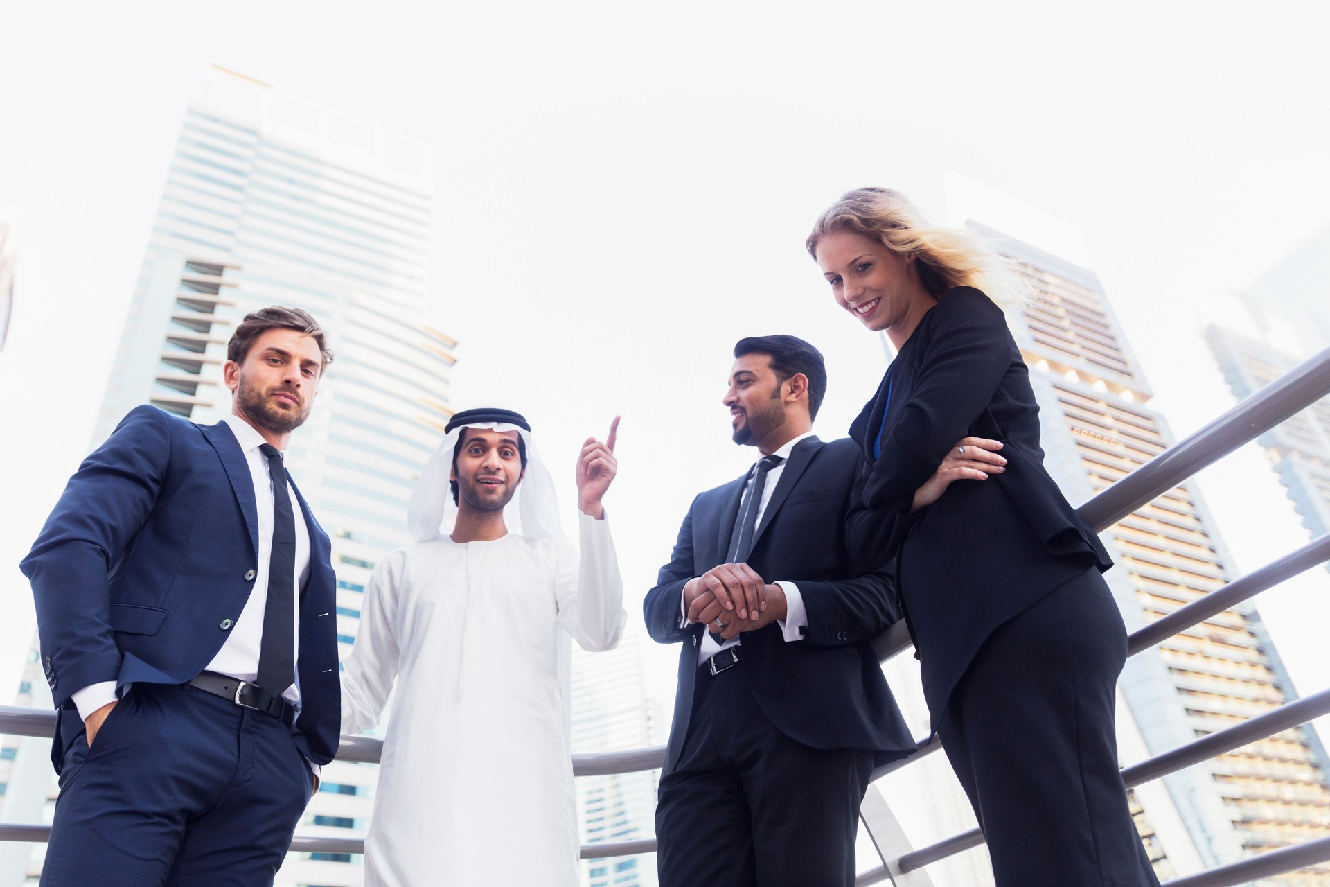 Arab businessman discussing work with his colleagues